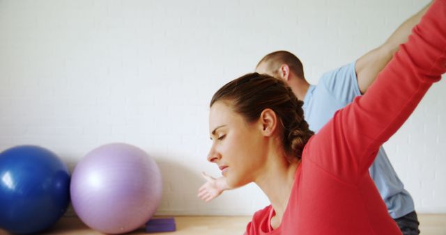 People Practicing Yoga With Exercise Balls in Background - Download Free Stock Images Pikwizard.com