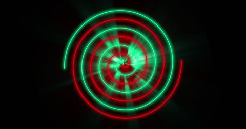 Dynamic spiral light art with vibrant red and green swirls