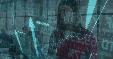 Businesswoman Analyzing Digital Financial Graphs in Corporate Office