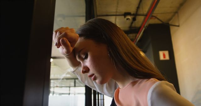 Stressed Woman Contemplating in Modern Office Environment - Download Free Stock Images Pikwizard.com