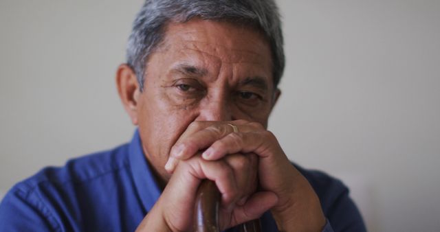 Senior biracial man holding his head in thought - Download Free Stock Photos Pikwizard.com