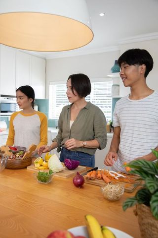 Diverse Family Cooking Together in Home Kitchen