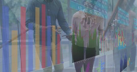 Business professionals walking atrium viewing transparent digital analytics dashboards