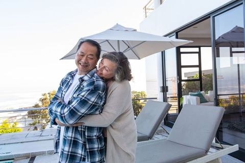 Senior Couple Embracing on Modern Patio Terrace