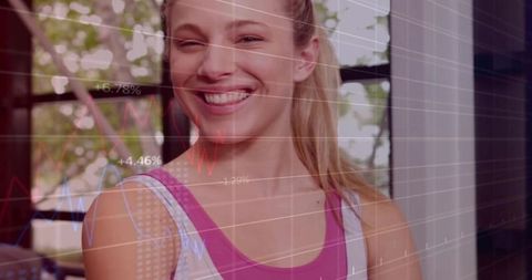 Smiling Woman Analyzing Fitness Data Through Graph Overlay