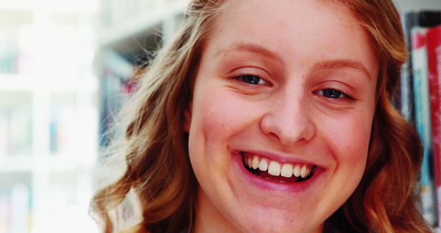 Portrait of Smiling Teenage Girl in School Library - Download Free Stock Images Pikwizard.com