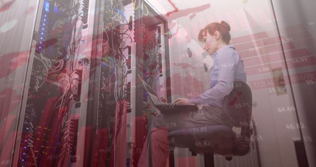 Female IT Technician Working with Servers in Data Center Overlayed with Stock Market Chart - Download Free Stock Images Pikwizard.com