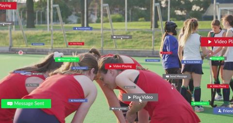 Female field hockey team huddling on sunlit turf with social media notification overlays
