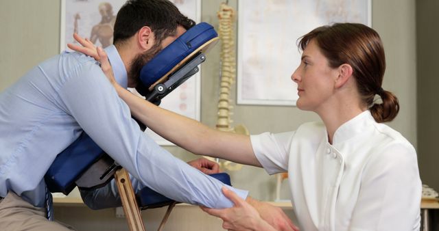 Physiotherapist Performing Therapeutic Arm Massage on Client - Download Free Stock Images Pikwizard.com