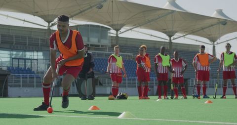 Multicultural Male Hockey Team Training in Sunny Weather