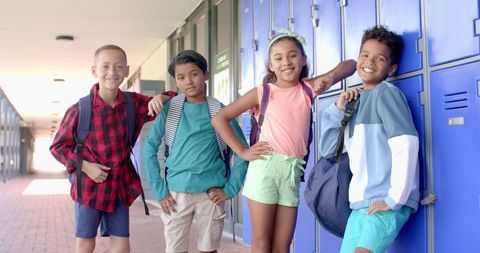 Diverse Students Confidently Posing By School Lockers Positive Atmosphere
