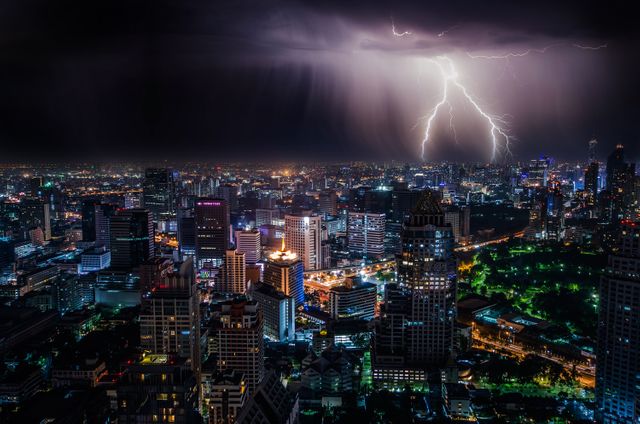 Dramatic Lightning Strike Over Busy Cityscape at Night - Download Free Stock Photos Pikwizard.com