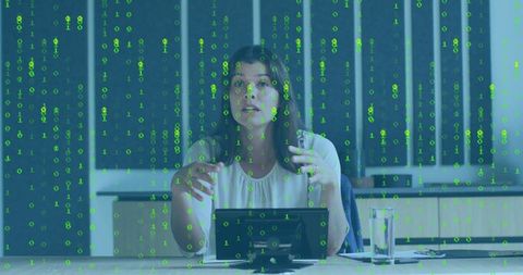 Woman presenting with digital data stream overlay