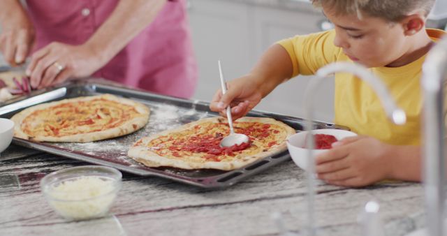 Father and Son Preparing Homemade Pizzas in Kitchen - Download Free Stock Images Pikwizard.com