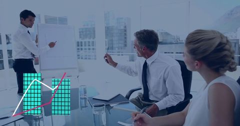 Colleagues discussing strategy with graphs in office