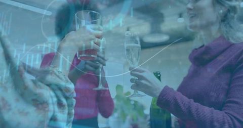 Women toasting champagne in kitchen with financial graph overlay celebrating team success