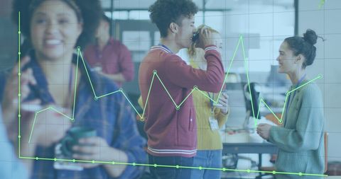 Data analytics overlay on diverse team in office meeting