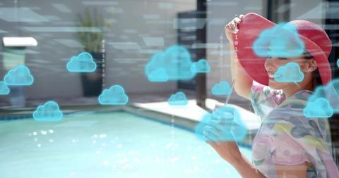 Woman enjoying poolside drink wearing red sunhat, cloud computing ar overlay