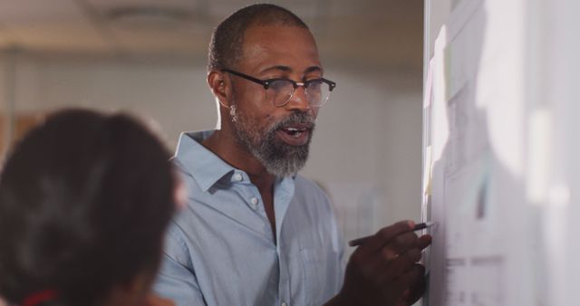 Male Professor Teaching Students on Whiteboard in Classroom - Download Free Stock Images Pikwizard.com