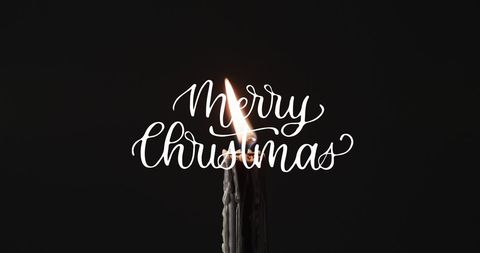 Warm Christmas Candle Light on Black Background