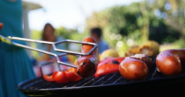 Close-Up of Grilled Sausages and Vegetables at Backyard Barbecue - Download Free Stock Images Pikwizard.com