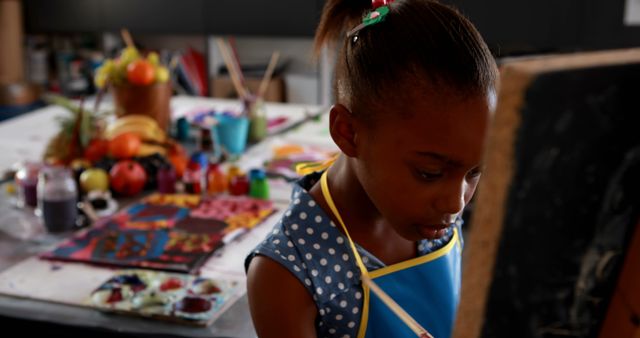 Young Girl Engaged in Artistic Painting at Classroom Tableau - Download Free Stock Images Pikwizard.com