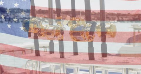 Celebratory american flag overlaid on fishing rods at waterfront