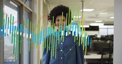Confident Businesswoman with Growth Charts in Modern Office