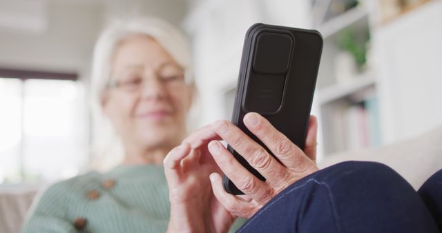 Senior Woman Using Smartphone at Home on Comfortable Couch - Download Free Stock Images Pikwizard.com