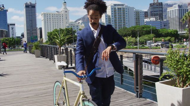 Young man in business attire navigating city street with bicycle. Portraying modern, eco-friendly transportation, it is ideal for urban lifestyle, commuting themes, and promoting the dynamic life of digital nomads.