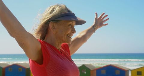 Smiling Senior Woman Enjoying Day at Sunny Beach