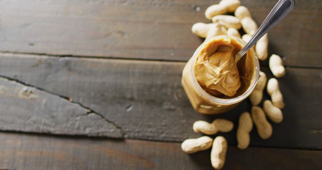 Close-up of Creamy Peanut Butter and Peanuts on Rustic Wood - Download Free Stock Images Pikwizard.com