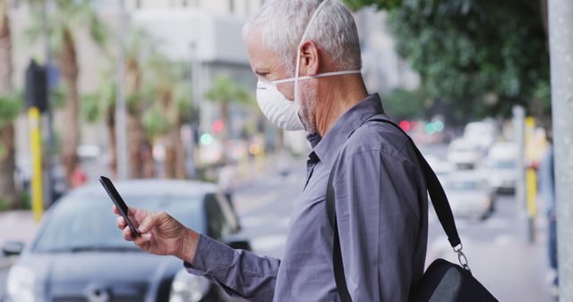 Senior Man Wearing Face Mask Checking Phone on City Street - Download Free Stock Images Pikwizard.com