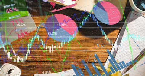 Financial data overlay with office supplies and graphs