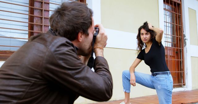 Photographer Capturing Model Posing Outdoors in Urban Location - Download Free Stock Images Pikwizard.com