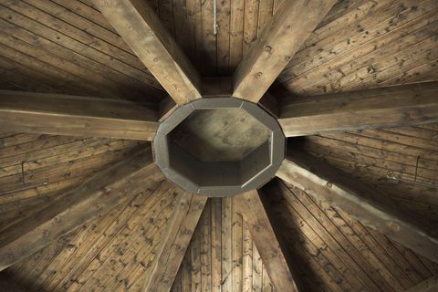 Rustic wooden ceiling with symmetrical patterns