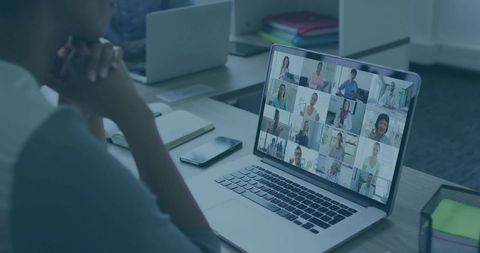 Woman Participating in Virtual Conference at Modern Workspace
