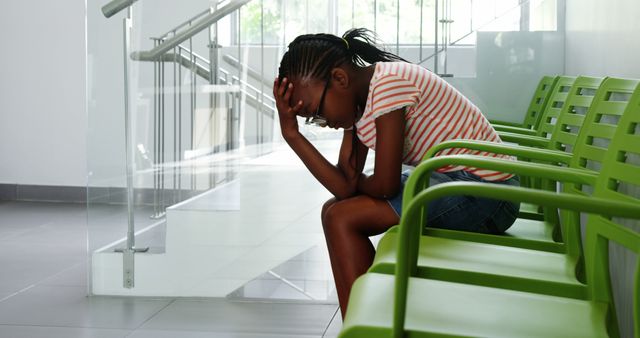 Young Girl Sitting in Waiting Room Feeling Anxious - Download Free Stock Images Pikwizard.com