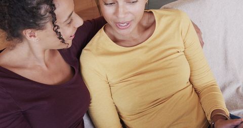 Happy Biracial Lesbian Couple Enjoying Tablet Together at Home - Download Free Stock Images Pikwizard.com