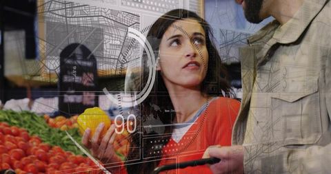 Couple holding yellow pepper and shopping in produce aisle with futuristic hud overlay