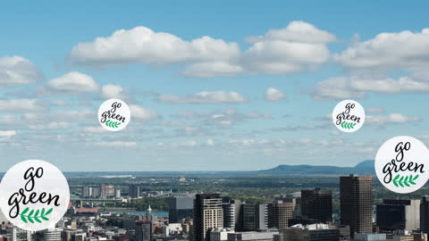 Green Initiative Icons Over Urban Skyline