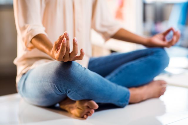 Business executive practicing yoga in office, promoting work-life balance and stress relief. Ideal for articles on corporate wellness, mental health, and productivity. Suitable for wellness programs, mindfulness workshops, and healthy lifestyle campaigns.
