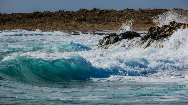 Waves Crashing Against Rocky Shore on a Windy Day - Download Free Stock Images Pikwizard.com