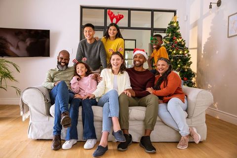 Diverse Family Celebrating Christmas at Home with Joyful Expressions