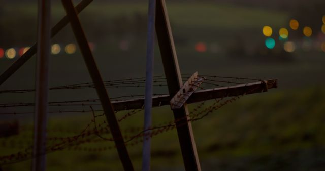 Barbed Wire Fence Overlooking Blurred Night City Lights - Download Free Stock Images Pikwizard.com