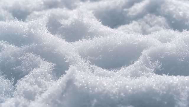 Macro snow crystal texture with glittering frost needles, soft bokeh and sunlit sparkle