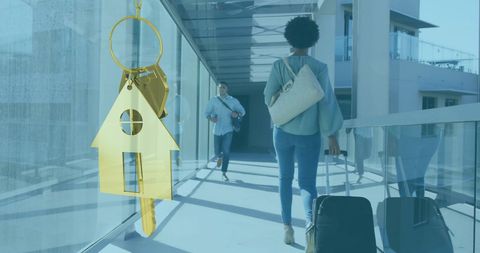 Gold House Key Symbol with Business Professionals Background