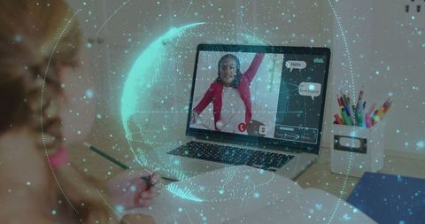 Girl engaged in remote learning with laptop and creative supplies