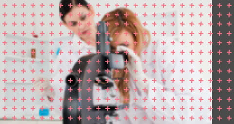 Scientists Analyzing Samples with Modern Microscope Equipment