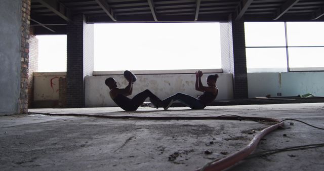 Two Men Exercising with Medicine Ball in Abandoned Building - Download Free Stock Images Pikwizard.com